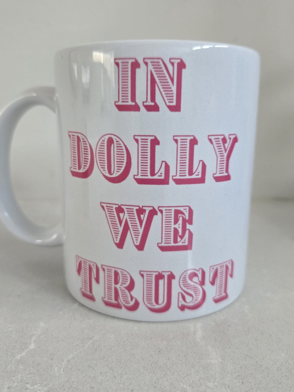 In Dolly We Trust Brand New Ceramic Coffee Mug Dolly Pardon White Pink 3.75"